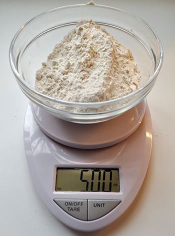 Kitchen scale with bowl of 5 oz of flour