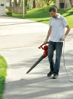 Use leaf blower to blow fertilizer off hardscapes and back onto the lawn