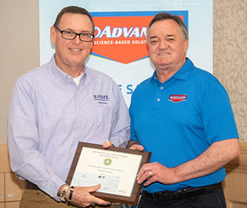 (l-r) Dennis Patton was presented the National Association of County Agricultural Agents communications award by Lance Walheim, national book author and garden expert for Bayer Advanced lawn and garden products