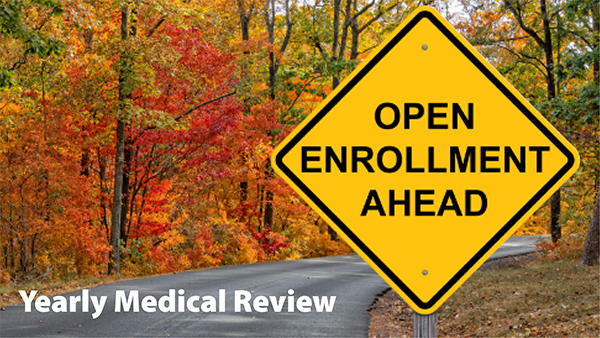 Curving road with Medicare Open enrollment sign