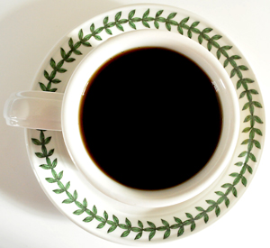 Cup of black coffee on a saucer