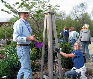 Extension Master Gardeners build trellises in the Garden Gallery demonstration garden