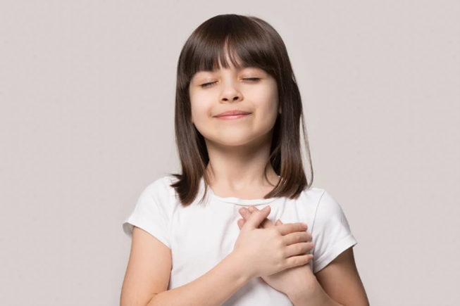 4-H'er young girl with her hands on her chest showing gratitude 