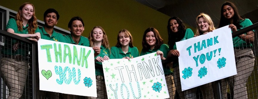 4-H'ers holding Thank You signage