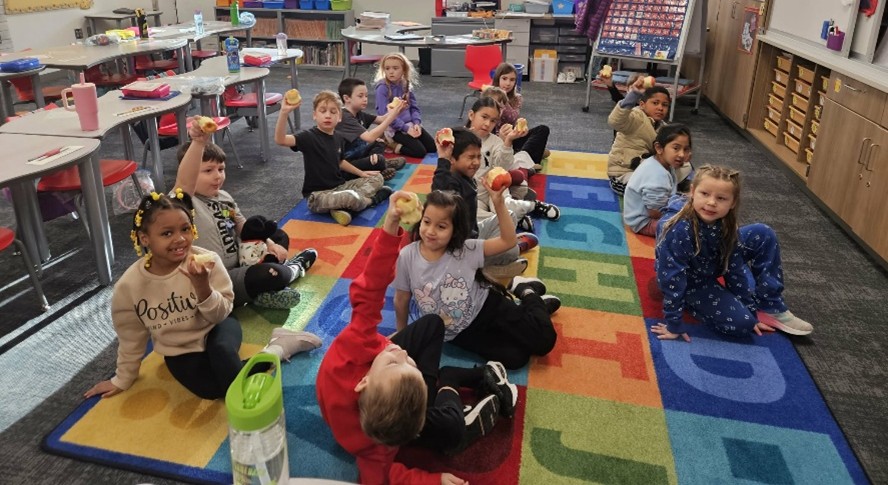 Students using “mind jars” (water, soap and glitter) to practice calming themselves when they are frustrated or anxious. The students shake the jar and count until the glitter settles. 