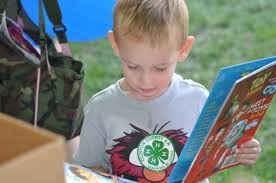 Young boy reading a book 