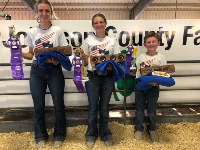 youth hold purple ribbons