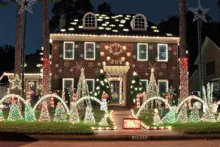 house decorated with seasonal holiday light display 