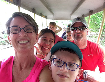 Exchange student host family riding tram