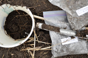 Bucket of soil, soil probe and bags of soil