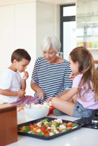 photograph of people cooking together