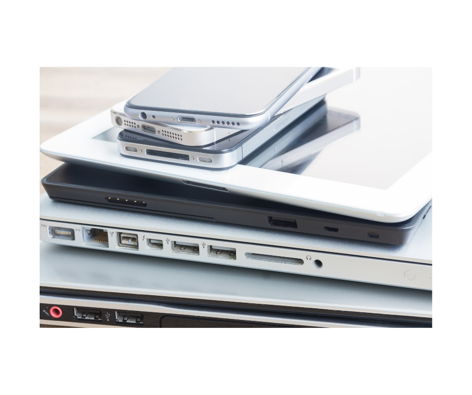 stack of computers and cell phones 