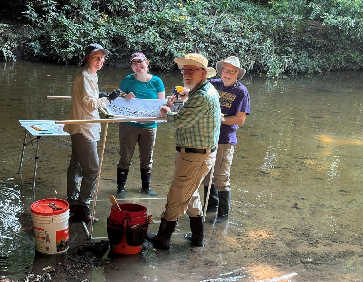A group of Master Naturalist volunteers conducts testing in the Mill Creek Watershed